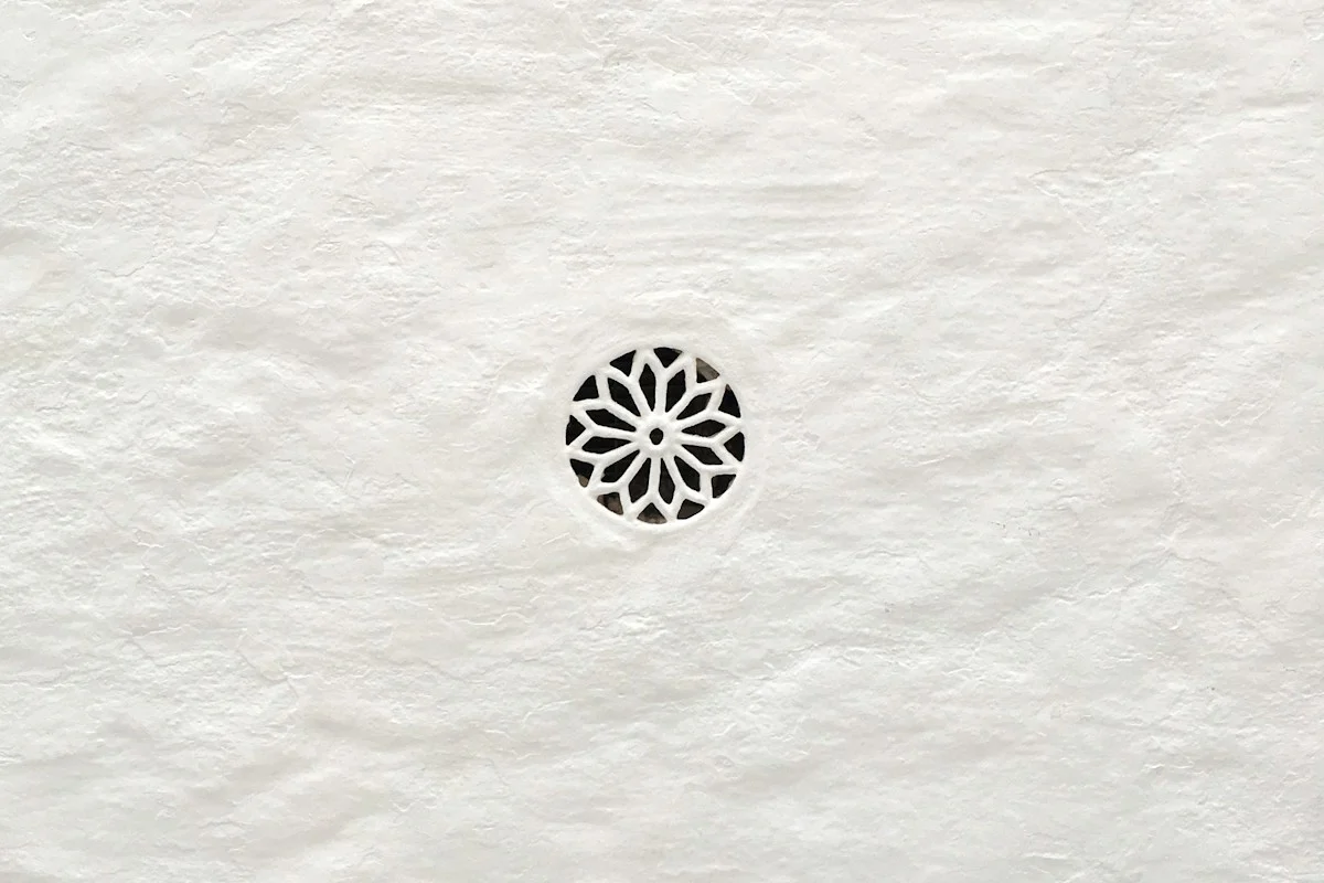 Geometric pattern carved into white paper